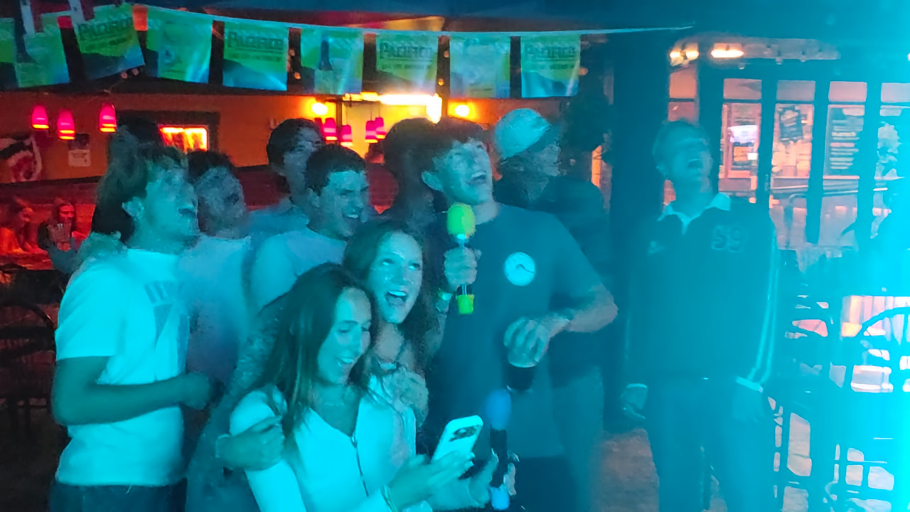 A group of guests singing together at a public sloKaraoke event